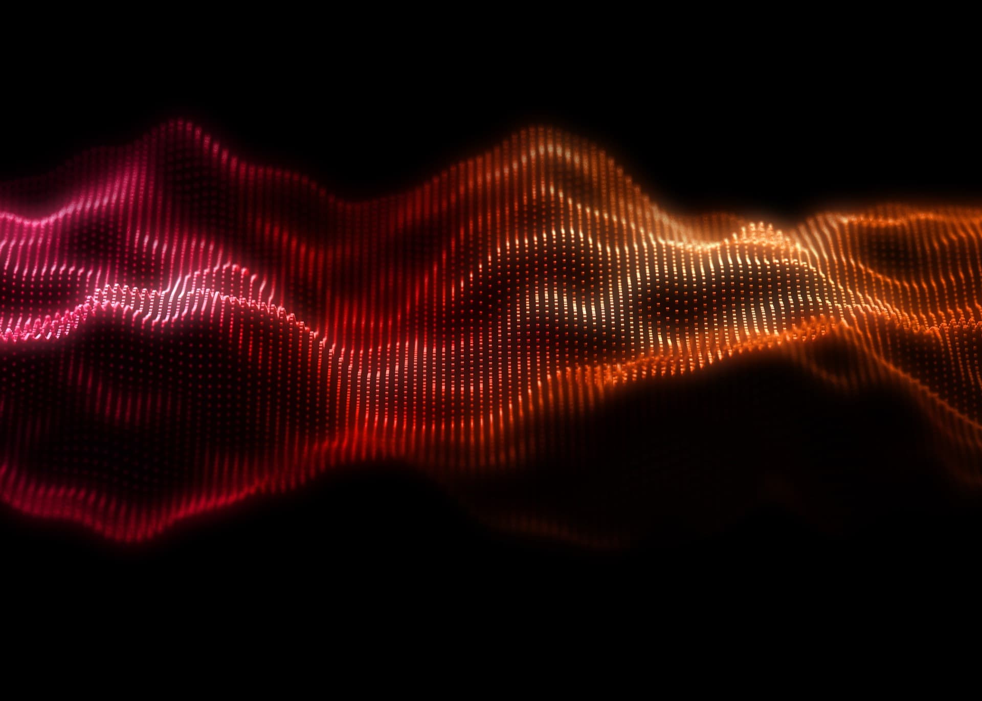 Cinematic audio waveform glowing red and gold against black